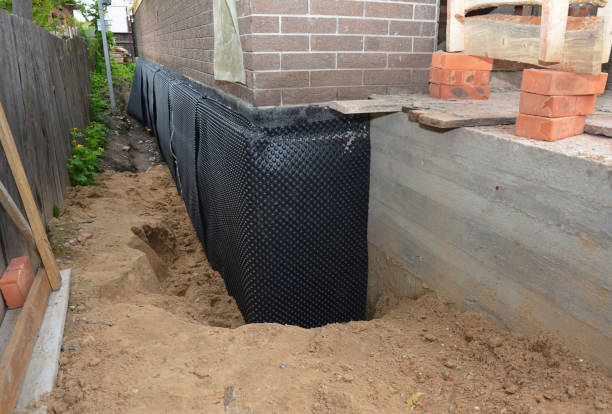 Happy homeowners after waterproofing job in Morrisonville